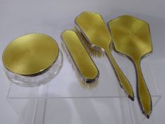 A Lady's Four Piece Silver and Yellow Enamel Dressing Table Set, London hallmark, mm P & B,