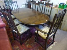 A Set of EIGHT Dark Oak Ercol Dining Room Chairs, together with an oval extending table.