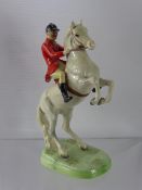 A Beswick Study of the Hunt Master, nr 838, depicted on a rearing horse, approx 25 cms high.