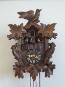 A 20th Century German Cuckoo Clock, with weights.