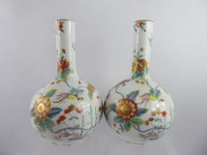 A Pair of 19th Century Onion Vases, hand painted with chrysanthemum and Chinese pheasant, with