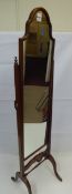 A Mahogany Cheval Mirror, the mirror having a scalloped top with turned stretcher to base, approx 40