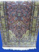 A Fine 20th Century Persian Wool and Silk Carpet, the carpet depicting the Tree of Life, within a