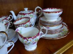 A Royal Worcester Style Part Tea Set, including cake plate, six tea plates, six cups and saucers,