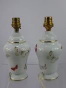 Limoges, A Pair of Porcelain Bedside Lamps, hand painted with butterflies, approx 20 cms high with
