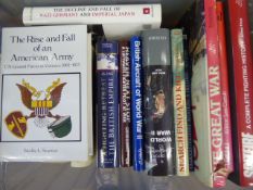 Nine Boxes of Hard Cover and Paperback Books, relating to WWI, WWII and other Military titles.