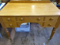 A Heal's of London Vintage Pine Dressing Table, four short drawers with one long drawer, turned legs