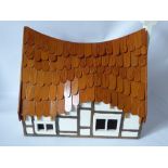 A Hand Crafted Wooden Chalet Style Doll's House, with open plan living and stairway to upstairs
