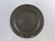 An English Pewter Single Reeded Plate, London mm, approx 30.5 cms dia, circa 1760.