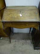 A Louis XVI Antique Rose Wood Secretaire, the secretaire having cabriole style legs with brass