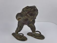 An Antique Bronze Sculpture of a Toad, depicted upright and striding, on a naturalistic base,