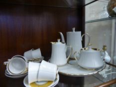 A Russian Porcelain Tea Set, comprising six cups and saucers, creamer, sugar bowl, coffee pot and