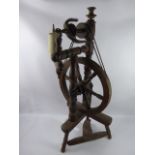 A Vintage Mixed Wood Spinning Wheel.