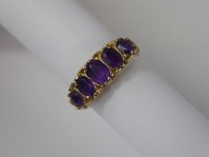 A Lady's Vintage 9 ct Gold Amethyst Gypsy Ring, largest amethyst approx 6 x 4.5 mm, smallest 4.5 x