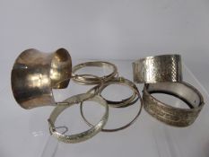 A Miscellaneous collection of Silver Bracelets and Bangles, hand engraved, one depicting swallows,