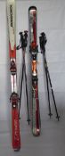 Two Pairs of Vintage Ski's, including Rossignol and Atomic, together with the ski poles.