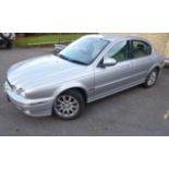 A 2001 Silver Jaguar X-Type V6 Four Door Saloon. The vehicle having a 2495 cc petrol engine and