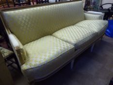 An Antique French Style Three Seat Sofa, the white paint.and gilded sofa having square back with