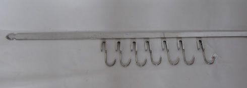 A Stainless Steel Pot Rack, with stainless steel meet hooks, all the necessary bits for wall