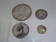 An 1887 Victorian Crown (gc), together with an 1864 two shilling piece. (2)