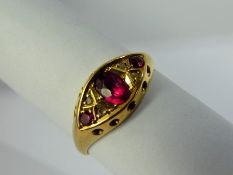 An Antique Lady's 18 ct Ruby and Diamond Ring, centre ruby 5 x 3.5 mm, 12 x 2 mm rubies, 4 x rose