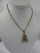 An Edwardian 9ct Gold Amethyst Drop Pendant, with 9ct gold chain, approx 38 cms, approx 8.2 gms (