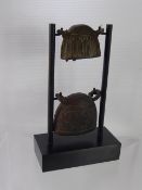 Two Antique South Asian Bronze Cow Bells, approx 8 x 6.5 cms and the smaller version 6 x 5 cms,