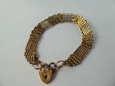 A Lady's 9 ct Gold Gate Link Bracelet, with heart form clasp, approx 13.4 gms