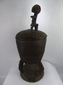 A West African Tribal Beer Pot and Cover, with decorative carving to sides and top. (af)