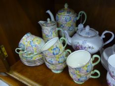 A Part Queen Anne 'Narcissus' Tea Set, including tea pot, cake plate, six tea plates, six cups and