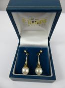 A Pair of 9 ct Gold and Cultured Pearl Drop Earrings, the pearls approx 7.5mm, approx 3 gms