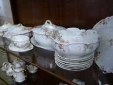 A Part Limoge G. Stephenson Porcelain Service, comprising three lidded tureens, bowl, sauce boat and