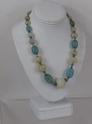 A French Vintage Blue Opaque Glass Necklace, together with a silver quartz stone ring, size L,