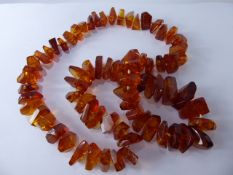 A Natural Amber Necklace, the translucent amber necklace with inclusions, approx length 70 cms,