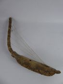 An Antique Tribal Sub-Saharan Musical Instrument, the harp made from a tree pod and covered with