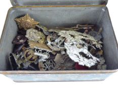 A Tin Containing Approx 50 Military Badges, some with lugs missing.