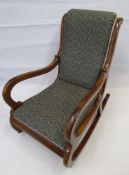 A Mahogany Framed Rocking Chair, with green upholstery.