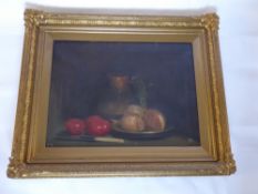 An Early 20th Century Still Life, Oil on canvas, depicting Onions and Tomatoes, monogram lower right