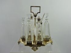 A Silver Plated Edwardian Cruet Set, together with a cut glass enamel topped scent bottle with the