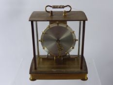 A Brass Cased German Kieninger & Obergfell 'Kundo' Mantel Clock, silvered face, together with