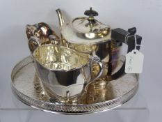 An Art Deco Silver Plate Tea Trio, comprising tea pot, milk jug and sugar bowl and tiered circular