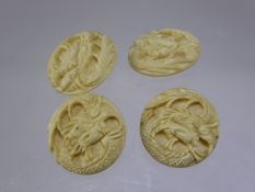 Four Chinese Antique Ivory Buttons. depicting dragons. (4)