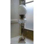 A Regency Style Corinthian Oil Lamp, the lamp having a cut-glass reservoir, approx 79 cms high.