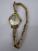 A Lady's 9ct Gold Tissot 17 Jewel Wrist Watch, having a silvered face with italic numerals on 9 ct