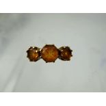 A Lady's Gems 9 ct Gold Three Stone Citrine Ring, centre stone 7mm approx 0.98 ct, side stones 6mm