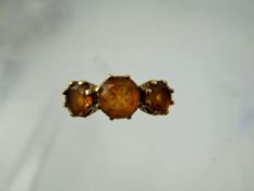A Lady's Gems 9 ct Gold Three Stone Citrine Ring, centre stone 7mm approx 0.98 ct, side stones 6mm