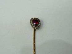 An Antique 14 ct Red Heart Shaped Stone Tie Pin.