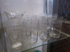 A Quantity of Edwardian Glass, including ten tumblers, a water jug and two hollow stem champagne
