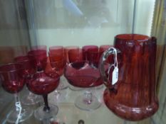 A Quantity of Victorian Coloured Glass, including Cranberry Pitcher, bonbon dish, fourteen sherry