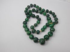 A Lady's Antique Polished Malachite Bead Necklace, approx 65 cms.